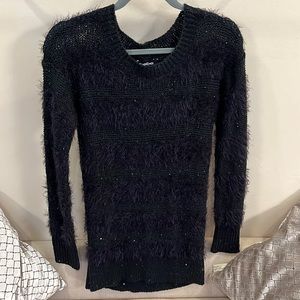 Womens long sleeved black sweater.